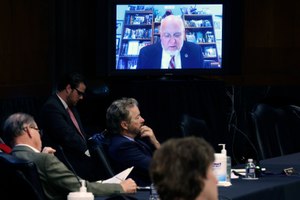 Senators and staff listen to Dr. Robert Redfield, director of the Centers for Disease Control and Prevention, speak remotely during a virtual Senate Committee for Health, Education, Labor, and Pensions hearing, Tuesday, May 12, 2020, on Capitol Hill in Washington. Image: Win McNamee/Pool via AP