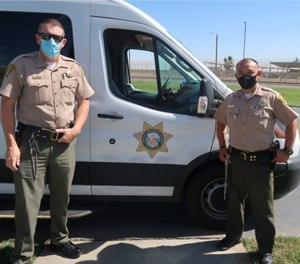 Correctional officers William Mayfield and G. Gomez.