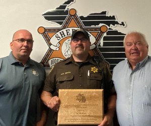 Huhta was presented with a Lifesaving Award and certificate from the Michigan Sheriff’s Association Director Matt M. Saxton and Sheriff Brian McLean. (Courtesy photo)