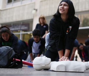 Thousands attending the ECCU conference marched in downtown San Diego to focus attention on the need for more CPR training and AEDs across the U.S. to help reduce deaths form sudden cardiac arrest, Thursday, Dec. 10, 2015. (Sandy Huffaker/AP Images for Citizen CPR Foundation)