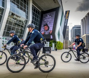 Sacramento, Calif., police officers ride bicycles near the Golden 1 Center