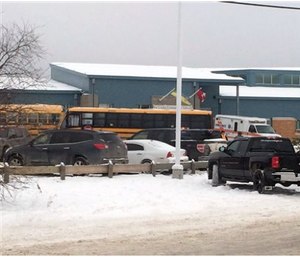 The outside of La Loche Community School Jan. 22. Prime Minister Justin Trudeau said the shootings occurred at a high school and another location but did not say where else. (Joshua Mercredi/The Canadian Press via AP)