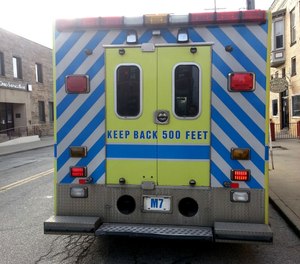 Two firefighters and two paramedics were injured Saturday after police say a woman struck the back of a Cleveland ambulance, causing it to rotate, hit another vehicle and then crash into a utility pole. (Photo/Tim1965, Wikimedia Commons, CC BY-SA 4.0)