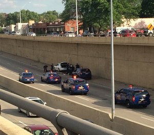 State Police investigate a shooting on a Detroit freeway in 2016.