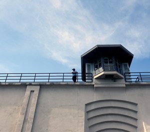 A CO stands on the wall of Clinton Correctional Facility on Saturday, June 13, 2015, in Dannemora, N.Y.