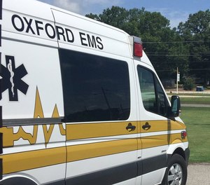 Two Oxford EMS paramedics were hospitalized after being exposed to unknown chemicals while treating a patient.