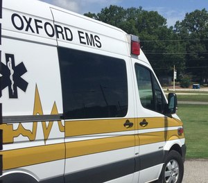 Two Oxford EMS paramedics were hospitalized after being exposed to unknown chemicals while treating a patient.