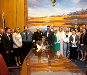 Governor Hickenlooper signs community paramedic bill into law. (Image courtesy Chris Howes)