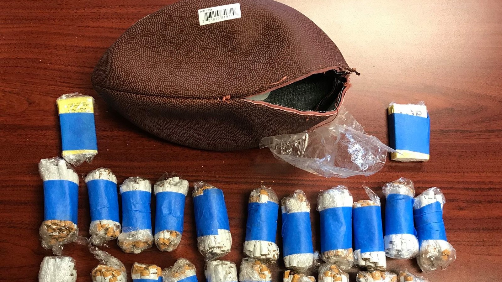 Ga. man arrested outside prison with three contraband stuffed footballs