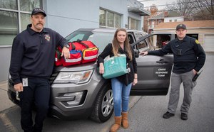 Crisis Response Team members Stephen Norris, firefighter and EMT; Heidi Murray, Shepherd Pratt mobile crisis specialist; and Frederick City Police Officer John Moczydlewski start their shift. A Frederick Police Department program to help people experiencing behavioral or mental health crises will be able to expand its hours after receiving more than $280,000 in federal funding from the Department of Justice.