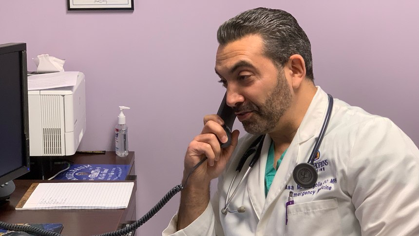 Dr. Asa Margolis, DO, MPH, MS; MIEMSS central intensivist physician, triages a call on the C4 line. Margolis is an assistant professor of emergency medicine at Johns Hopkins and program director of the EMS Fellowship. He joins nearly 60 other critical care physicians who work in the Critical Care Coordinator Center.