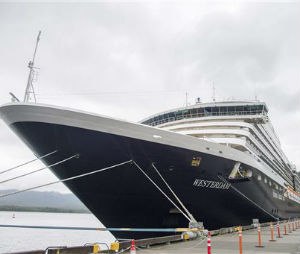 The Holland America Line cruise ship Westerdam sits in dock in Ketchikan, Alaska, on Thursday, June 25, 2015. Officials say eight passengers on an excursion off the ship and a pilot were in a plane that was found crashed against the granite rock face of a cliff about 20 miles northeast of Ketchikan, Alaska. All nine people aboard died in the crash, authorities said. (Taylor Balkom/Ketchikan Daily News via AP).