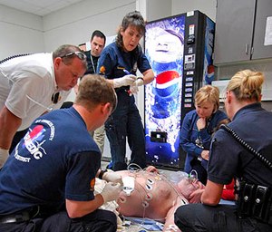 EMS providers assist a patient