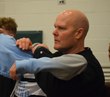 A correctional officer's will to win (and his wrestling skills) help him survive a battle against a terrorist