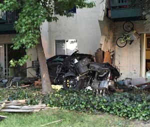 A suspected drunken driver crashed into this apartment complex in Livermore, killing a woman and an infant, police say. {Livermore Police Department)