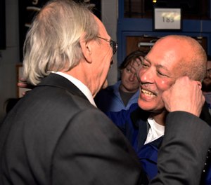 Dallas District Attorney John Creuzot, right, is congratulated as he enters an election watch party for the Dallas County Democrats at Dallasite bar and billiards in Dallas, Texas. Creuzot won after promising to reduce incarceration rates by 15 percent to 20 percent and to treat drug crimes as a public health issue. (Ben Torres/The Dallas Morning News via AP)