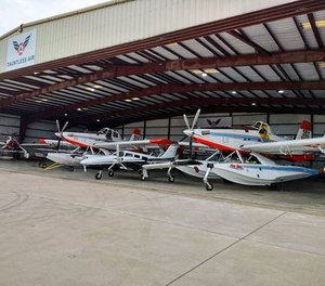 A few of Dauntless Air's 17 Fire Boss air tankers are pictured in a hangar.