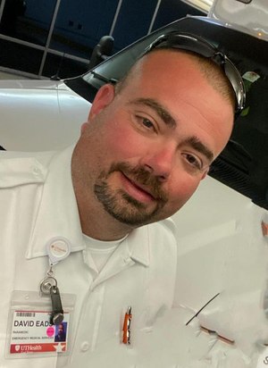 David Eads, 42, a dedicated paramedic for more than 24 years, was killed when his ambulance crashed into an 18 wheeler backing up across two lanes of traffic.