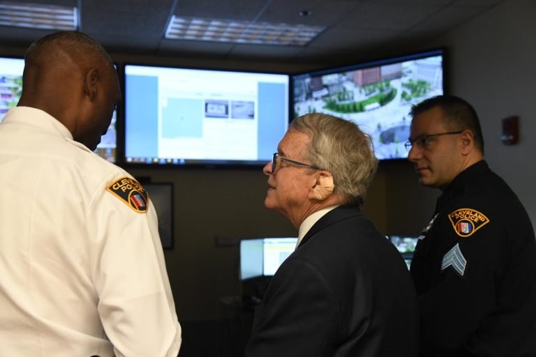 DeWine gets to see the RTCC in operation. He is joined by Cleveland Police Chief Wayne Drummond (left) and Sgt. Jose Garcia (right).