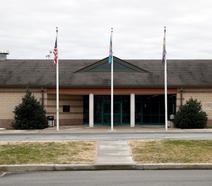 the front entrance of the James T. Vaughn Correctional Center in Smyrna, Del. One year after a deadly inmate riot and hostage taking.