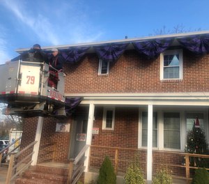 Members of FDNY Ladder Company 79 helped adorn the EMS House at Richmond University Medical Center with black and purple mourning bunting, the medical center posted on Facebook.