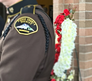 A fellow Pierce County Sheriff’s Deputy is pictured at the memorial service for Deputy Daniel McCartney, Jan. 17, 2018.