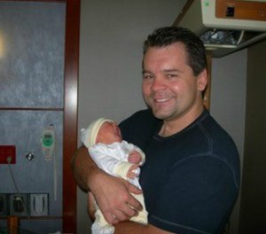 Dickson with his first-born daughter.