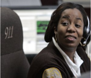 Brunswick County Dispatcher and Chief of Communications Joy Seward man's the desk in her office in Lawrenceville, Va.