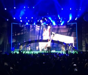 In this photo provided by Francis Ramsden, Enrique Iglesias grabs a drone onstage during a concert in Tijuana, Mexico on Saturday, May 30, 2015. A representative for the singer says in a statement to The Associated Press that Iglesias was