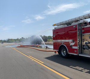 While the crews were extinguishing the fire, a propane tank on the vehicle exploded, sending debris shooting in all directions.