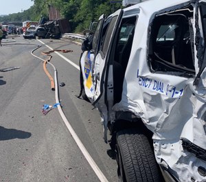 The crash started a chain reaction that left significant damage to an ambulance, fire truck and state police SUVs. (Photo/State Troopers Fraternal Association of NJ)