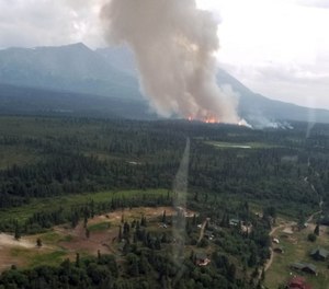 A wildfire sparked by a lightning strike was spreading fast and within a mile of Alaska’s oldest hunting lodge and a checkpoint on the Iditarod Trail Sled Dog Race. (Photo/Alaska Division of Forestry)