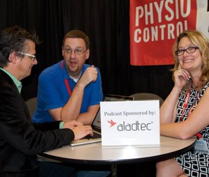 Scott Kier, center, discusses paramedic best practices with Chris Montera and Anne Montera at an EMS conference.