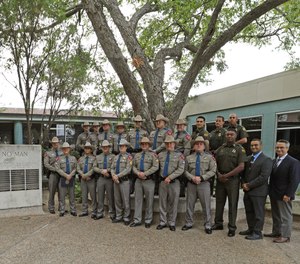 The first-ever Texas DPS Emergency Medical Technician class stands at graduation on Thursday, Sept. 30, in Austin, Texas.