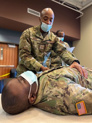 U.S. Air Force Staff Sgt. Kenneth Brown demonstrates how to check a patient on Jan. 17 during EMT training at the Farmingdale Armed Forces Reserve Center in Farmingdale, New York.