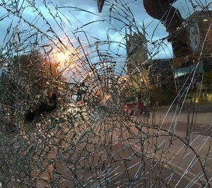 Cleveland Fire Department Ladder 23 was out of service after being struck with bottles and rocks while responding to a fire downtown.