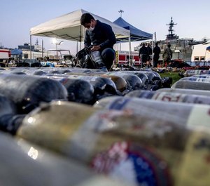 SCBA are cleaned at the site of the USS Bonhomme Richard.