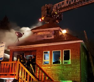 Two Chicago firefighters were injured in a house fire on Monday night.