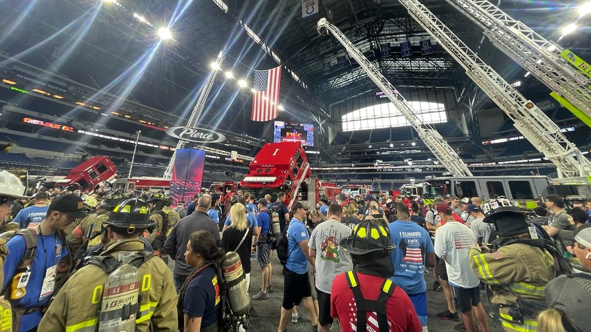 A crowd gathers as participants prepare for the 9/11 Memorial Stair Climb at Lucas Oil Stadium.