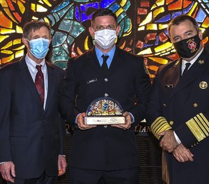 Philadelphia Firefighter Sean Dugan (center) was named the city's Firefighter of the Year in October after saving a baby from a burning vehicle while off-duty. Dugan received the Award of Valor from The National Liberty Museum this past week.