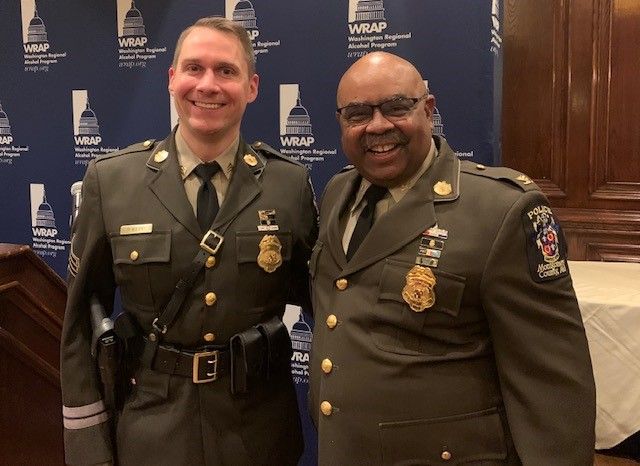 Sgt. Patrick Kepp (left) and Chief Marcus Jones (right) at an awards ceremony in 2021.