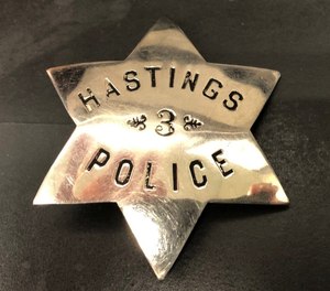 This photo shows the long-lost badge of Hastings police officer Albert Jacobson, who was killed in the line of duty in 1894.