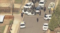 Denver police car crashes, flips onto roof during pursuit