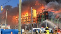Va. firefighters battle massive fire in under-construction condo building