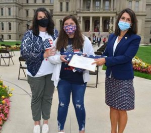 Randy Rumler's wife, Alisha, and daughter, Raelynn, attended the ceremony. (Photo/Michigan House of Representatives)