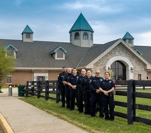 Corrections officers pose for a photo outside of the Fayette County Detention Center in Lexington, Kentucky.