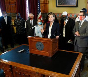 Iowa Gov. Kim Reynolds speaks after signing an executive order granting convicted felons the right to vote during a signing ceremony on Aug. 5, 2020.