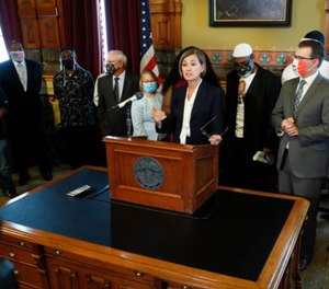 Iowa Gov. Kim Reynolds speaks after signing an executive order granting convicted felons the right to vote during a signing ceremony on Aug. 5, 2020.