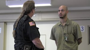 A female corrections officer at Airway Heights Corrections Center speaks with an inmate while on duty. CO Daniele Tavenner was assigned to the facility in April 2019 but resigned just days later due to the alleged harassment she received.