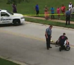 Police and EMS responders attend to Michael Brown at the scene of the officer-involved shooting in Ferguson (Mo.) where Brown was killed in a confrontation with Officer Darren Wilson. Left out of all of the so-called analysis in the mainstream media in the aftermath of the Ferguson OIS is any real examination of the science of human performance during rapidly-unfolding, high-stress events.